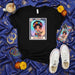 LA CHOLA Loteria Card T-Shirt: Cute Chicana Woman with Floral Crown & Butterfly | Mexican Bingo Inspired Graphic Tee | Unisex Cultural Folk Art Style Shirt and Gift Mexicada