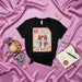 LA DULCE Mexican Loteria Card Graphic Tee - Cute Pastel Girl with Cupcake, Lollipop & Apple - Hispanic Culture Inspired Unisex T-Shirt Mexicada