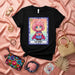 LA ENFJ Lotería Card T-Shirt | Cute Pink Hair Superhero Girl Graphic Tee | MBTI Personality Type Shirt | Unisex Gift for Extroverted Feeling Individuals Mexicada