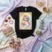 LA ENFJ The Advocate Lotería Card T-Shirt, Cute Anime Girl Reading Book Design, Ideal MBTI Personality Gift Tee, Aesthetic Tarot Style Graphic Shirt Mexicada