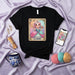 LA GACHA Kawaii Pastel Princess T-Shirt Cute Anime Character Lotería Card 13 Gamer Girl Graphic Tee Unisex Aesthetic Clothing Gift Idea Mexicada