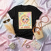 LA GÜERA La Lotería Card 12 Cute Blonde Girl Flower Crown Graphic Unisex T-Shirt - Mexican Bingo Game Art Tee for Women & Men, Pastel Colors Print Mexicada
