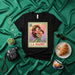 LA MADRE Mexican Loteria Card Graphic T-Shirt | Cute Mother Holding Child Drawing | Unisex Tee Gift for Mom, Mother's Day, or Latina Culture Lovers Mexicada