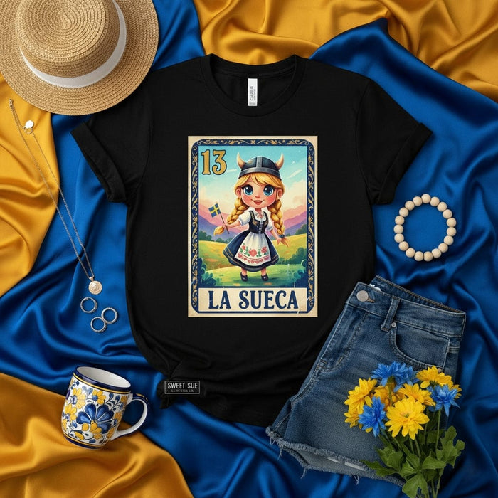 LA SUECA Loteria Card T-Shirt, Cute Cartoon Swedish Girl Viking Helmet Traditional Dress Swedish Flag, Unisex Graphic Tee Gift for Sweden Lover, Scandinavia Heritage Shirt, Number 13 Lotería Game Art Print Mexicada