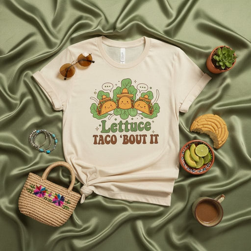 Lettuce Taco 'Bout It Shirt, Funny Taco Lovers Graphic Tee, Retro Food Pun T-Shirt, Cute Cartoon Tacos Cinco de Mayo Unisex Apparel, Mexican Food Humor Gift Idea, Cream Short Sleeve Top Mexicada