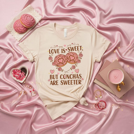 Love Is Sweet, But Conchas Are Sweeter T-Shirt, Unisex Concha Heart Shirt, Mexican Pan Dulce Tee, Valentine's Day Shirt, Foodie Love Gift, Latinx Bakery Pastry Top, Cute Pink Hearts and Flowers Design Mexicada