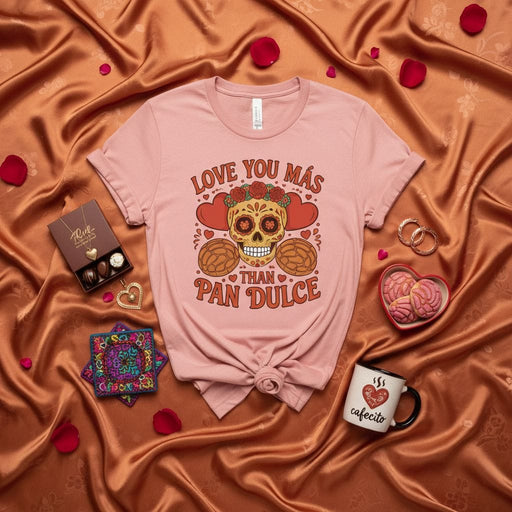 LOVE YOU MÁS THAN PAN DULCE, Dia De Los Muertos Skull Shirt, Sugar Skull T-Shirt, Pan Dulce Conchas Tee, Hispanic Food Lover Gift, Calavera with Flowers and Bread, Pink Unisex T-shirt for Valentines Day or Everyday Wear Mexicada