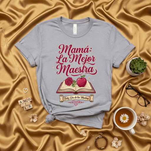 Mamá La Mejor Maestra Feliz Día de las Madres T-Shirt | Spanish Mother's Day Gift for Best Teacher Mom | Regalo para Mamá Maestra | Women's Short Sleeve Tee with Book and Apple Design Mexicada