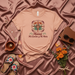 Mamá Mi Camino y Mi Meta T-Shirt | Spanish Mother's Day Shirt with Compass & Bird of Paradise Flower Graphic | Regalo para Mamá | Naranja Suave Unisex Tee Mexicada