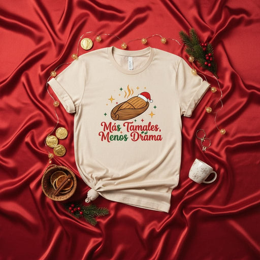 Más Tamales Menos Drama Christmas Shirt, Funny Holiday Tamale Tee, Xmas Fiesta Food Gift, Santa Hat Unisex Graphic T-Shirt Mexicada