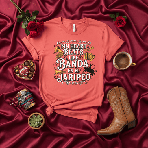 My Heart Beats Like Banda En El Jaripeo T-Shirt, Mexican Rodeo Bull Rider Concert Tee, Unisex Shirt for Música Regional Fans, Jaripeo Event Apparel, Coral Graphic Tee with Instruments and Cowboy Silhouette Mexicada