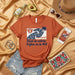Nivel de Estrés: Tráfico en la 405 - Camiseta Unisex Naranja con Diseño de Carretera, Palmera y Atasco, Rutas de California, Regalo para Conductores Mexicada