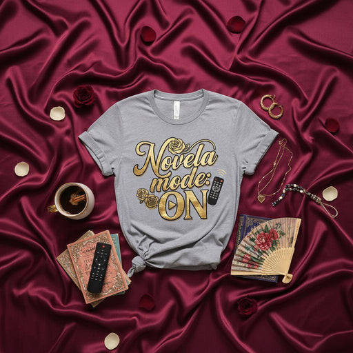 Novela Mode On T-Shirt, Gold Metallic Print Telenovela Fan Tee, Spanish Soap Opera Gift, TV Lover Shirt with Remote Control Graphic, Unisex Novelty Apparel Mexicada