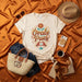 Órale Pues Marigold Flower Heart Hands Graphic Tee, Unisex Latine Culture Expression T-Shirt, Soft Cream Casual Apparel Mexicada