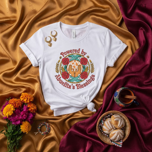 Powered by Abuelita's Blessings T-Shirt: Hispanic Heritage Gift, Grandma Love Tee, Latina Apparel, Floral Hands Design, Spanish Phrase Shirt, Día de los Muertos Inspired, Cultural Pride Unisex Top Mexicada