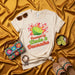 Powered by Limón & Desmadre Shirt, Funny Mexican Spanish T-Shirt, Limon Lime Citrus Graphic Tee, Fiesta Party Outfit, Latina Gift, Unisex Soft Cream Short Sleeve T-Shirt Mexicada
