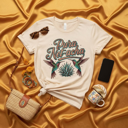 Pura Net-acha Hummingbird Agave T-Shirt, Mexican Fiesta Tee, Retro Latina Graphic Shirt, Cute Boho Style Top, Hispanic Heritage Gift, Unisex Soft Cream Short Sleeve Mexicada