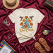 Qué Chido Hummingbird Floral T-Shirt, Unisex Graphic Tee, Aesthetic Bohemian Mexican Folk Art Style Shirt, Beige Cream Cotton Short Sleeve Top Mexicada