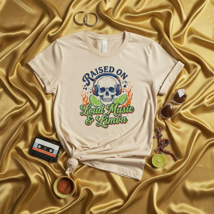 Raised on Loud Music & Limón Unisex T-Shirt | Skull with Headphones, Lime Slices, Fire Flames, Music Lover Tee, Spanish English Phrase, Latino Culture Inspired Apparel Mexicada