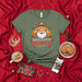 Santa's Favorite Chismoso Unisex T-Shirt - Funny Mexican Christmas Shirt with Sombrero Santa, Jingle Bells, Lights, and Chiles - Spanish & English Holiday Tee - Perfect Gift for Gossip Lovers Mexicada