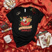 Sleigh Powered by Tamales Shirt, Funny Tamal Santa Claus Christmas T-Shirt, Mexican Fiesta Holiday Xmas Gift for Tamale Lovers, Unisex Black Tee Mexicada