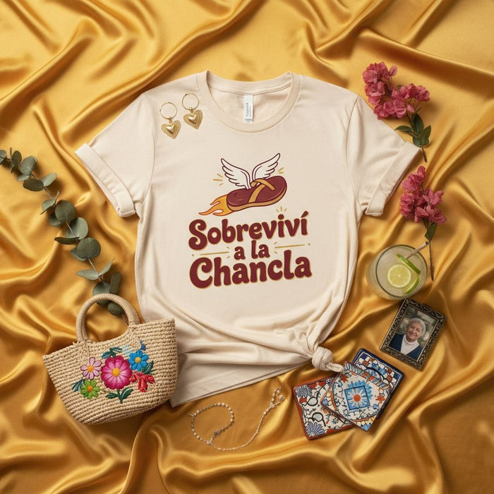 Sobreviví a la Chancla T-Shirt Funny Latino Saying Graphic Tee Spanish Humor Shirt La Chancla Culture Latina Mom Gift Idea Flying Flip Flop Design Unisex Top Mexicada