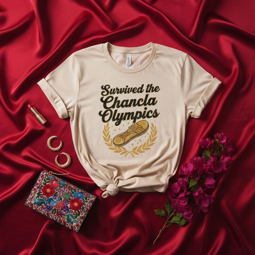 Survived the Chancla Olympics T-Shirt | Funny Latino Heritage Apparel | Spanish Culture Meme Tee | Humor Gift for Mom Dad Familia | Unisex Graphic Shirt with Chancla Flip Flop Design Mexicada