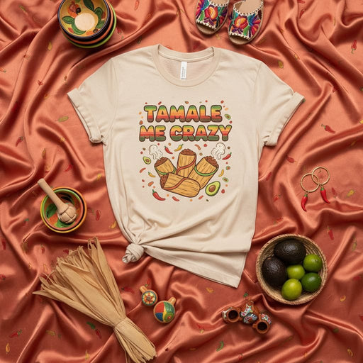 Tamale Me Crazy Graphic T-Shirt | Funny Mexican Food Pun Tee | Unisex Corn Husk Tamales Avocado Peppers Shirt for Fiesta Holiday Cinco de Mayo Gift Mexicada