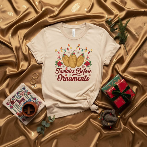 Tamales Before Ornaments Christmas Shirt, Funny Holiday Tamale Lover Tee, Mexican Food Festive Apparel, Navidad Fiesta Gift for Him Her, Unisex T-Shirt with Poinsettias and Lights Mexicada