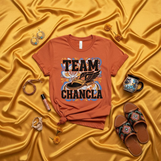 Team Chancla T-Shirt Unisex, Funny Hispanic Latino Culture Graphic Tee, Running Shoe with Wings Design, Orange Shirt, Gift for Mom Dad Familia, Day of the Dead Marigolds Aesthetic Mexicada