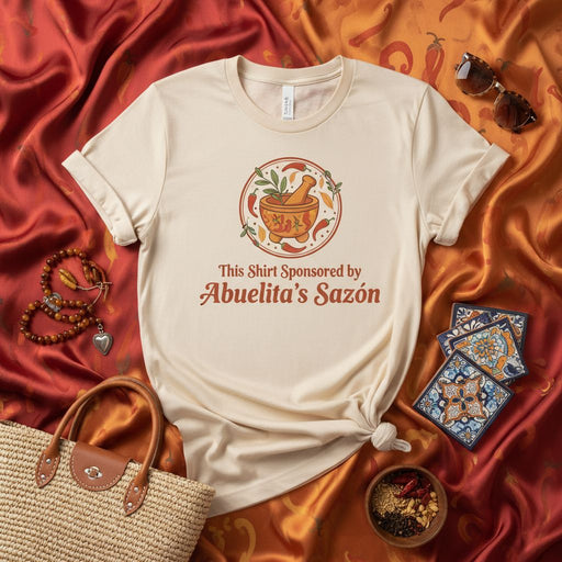 This Shirt Sponsored by Abuelita's Sazón: Funny Latinx Foodie T-Shirt with Molcajete Graphic, Spanish Grandma Cooking Gift, Hispanic Culinary Apparel, Mexican Heritage Tee. Mexicada