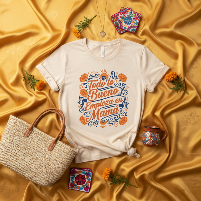 Todo lo Bueno Empieza en Mamá Spanish T-Shirt, Día de las Madres Floral Fiesta Design Tee, Mother's Day Gift for Mom, Latina Motherhood Shirt with Marigolds and Folk Art Style Print Mexicada