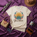 Ya Estuvo Boho Sun and Agave Floral Graphic T-Shirt | Retro Desert Sunrise Unisex Tee | Spanish Phrase Shirt | Aesthetic Botanical and Western Style Top for Men Women Mexicada
